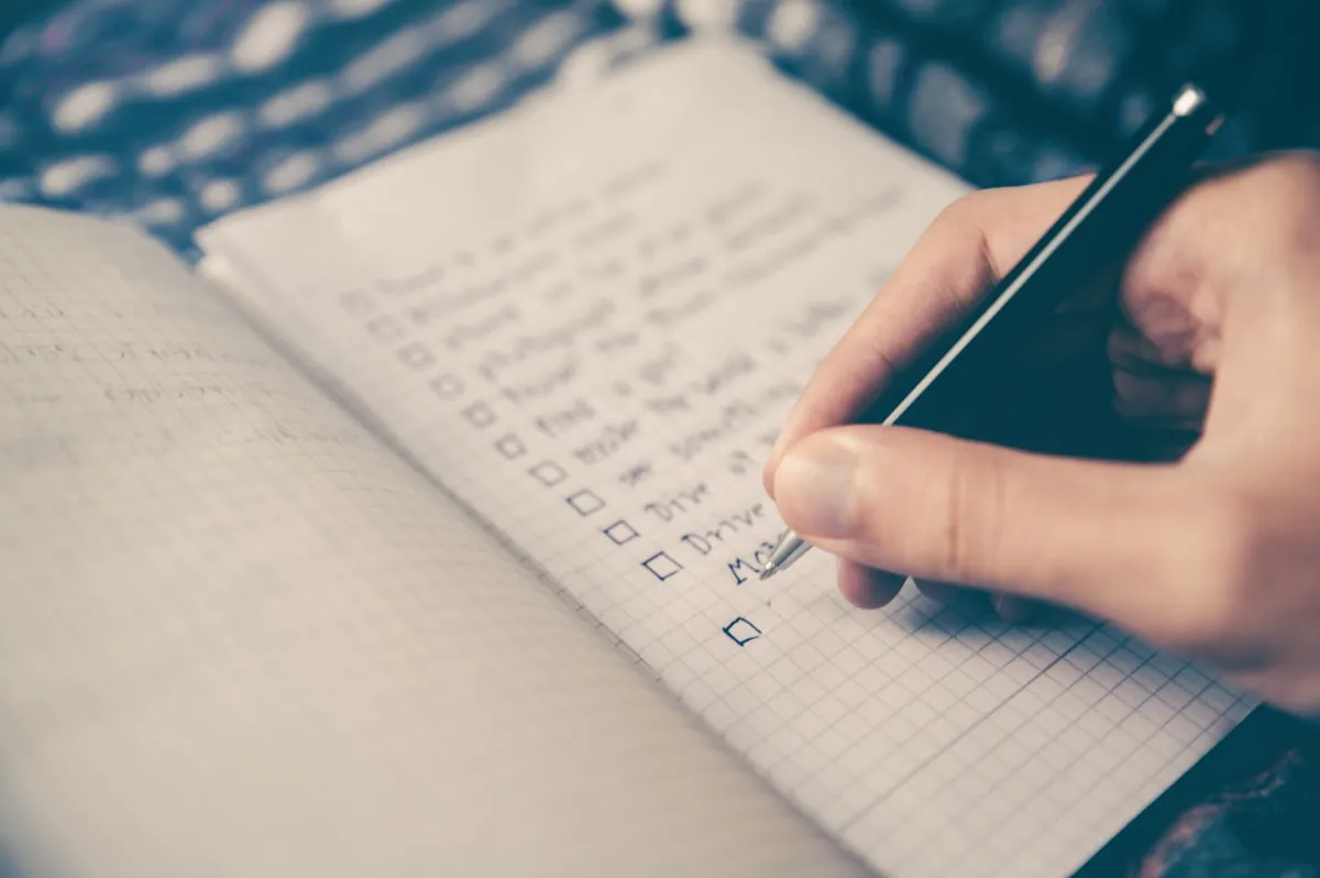 Notebook with checklist and pen, ready for daily tracking